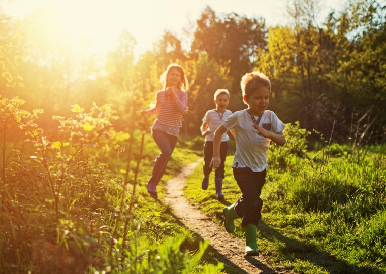 Kids running in nature.